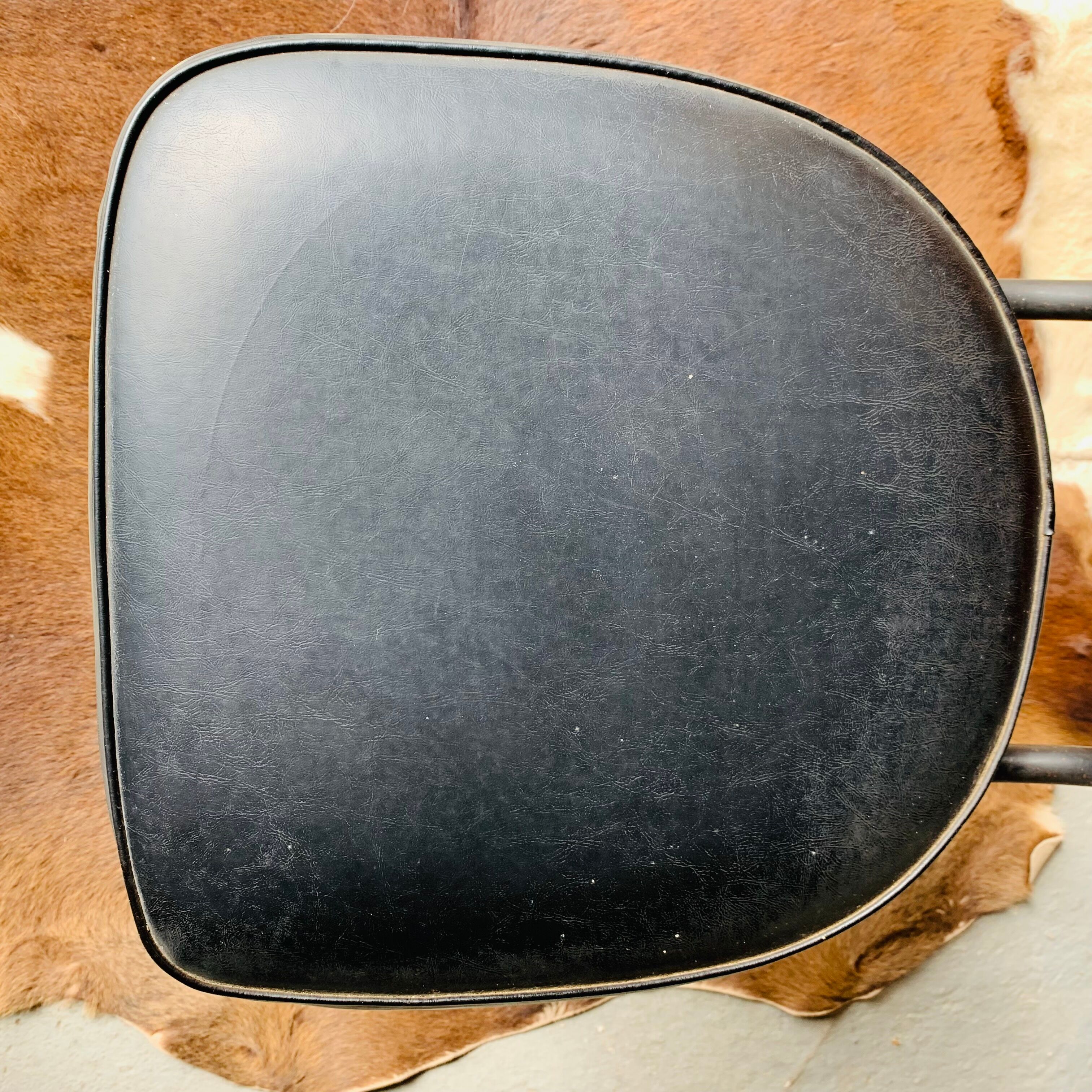 Pair of vintage black skai chairs