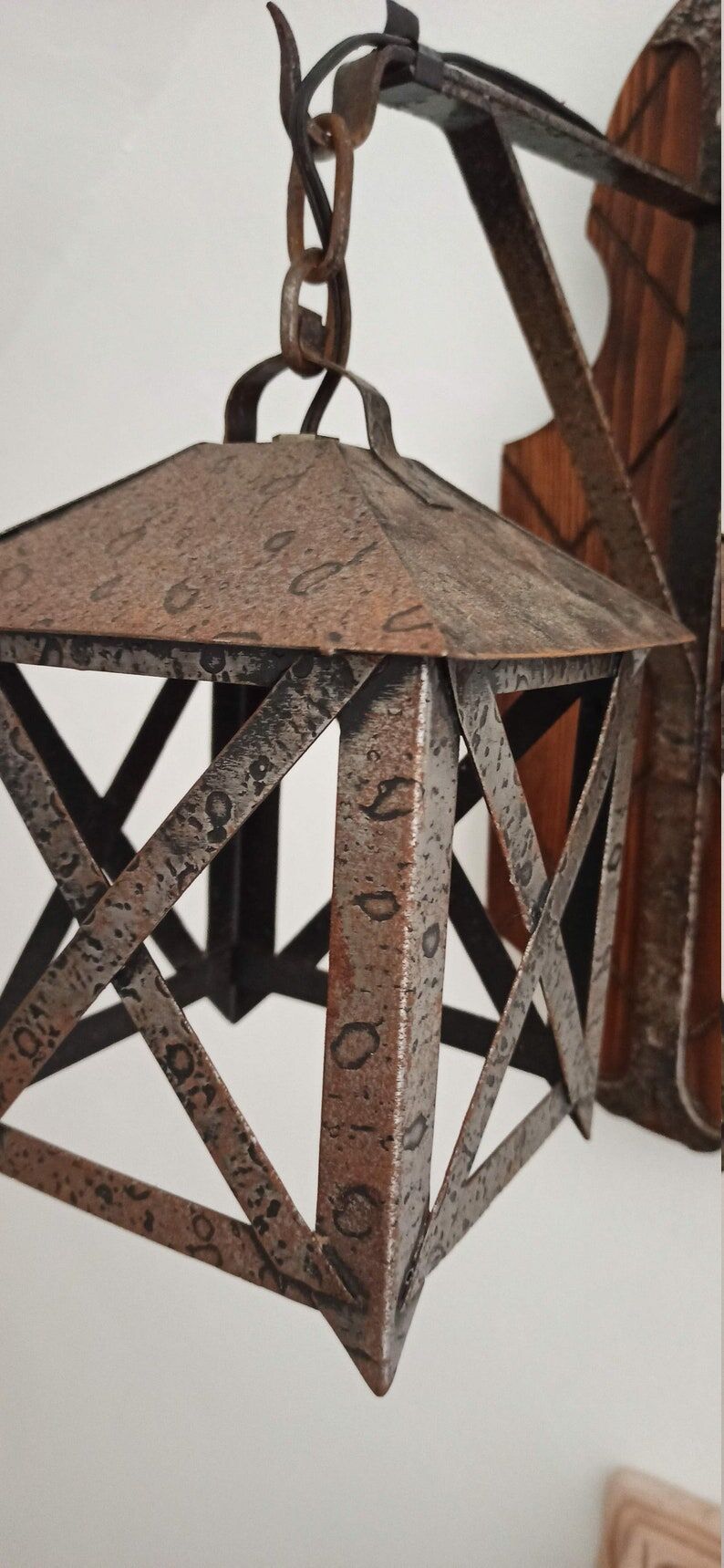 Wall lamp in wrought iron and old wood