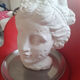 White plaster statue: man's head.