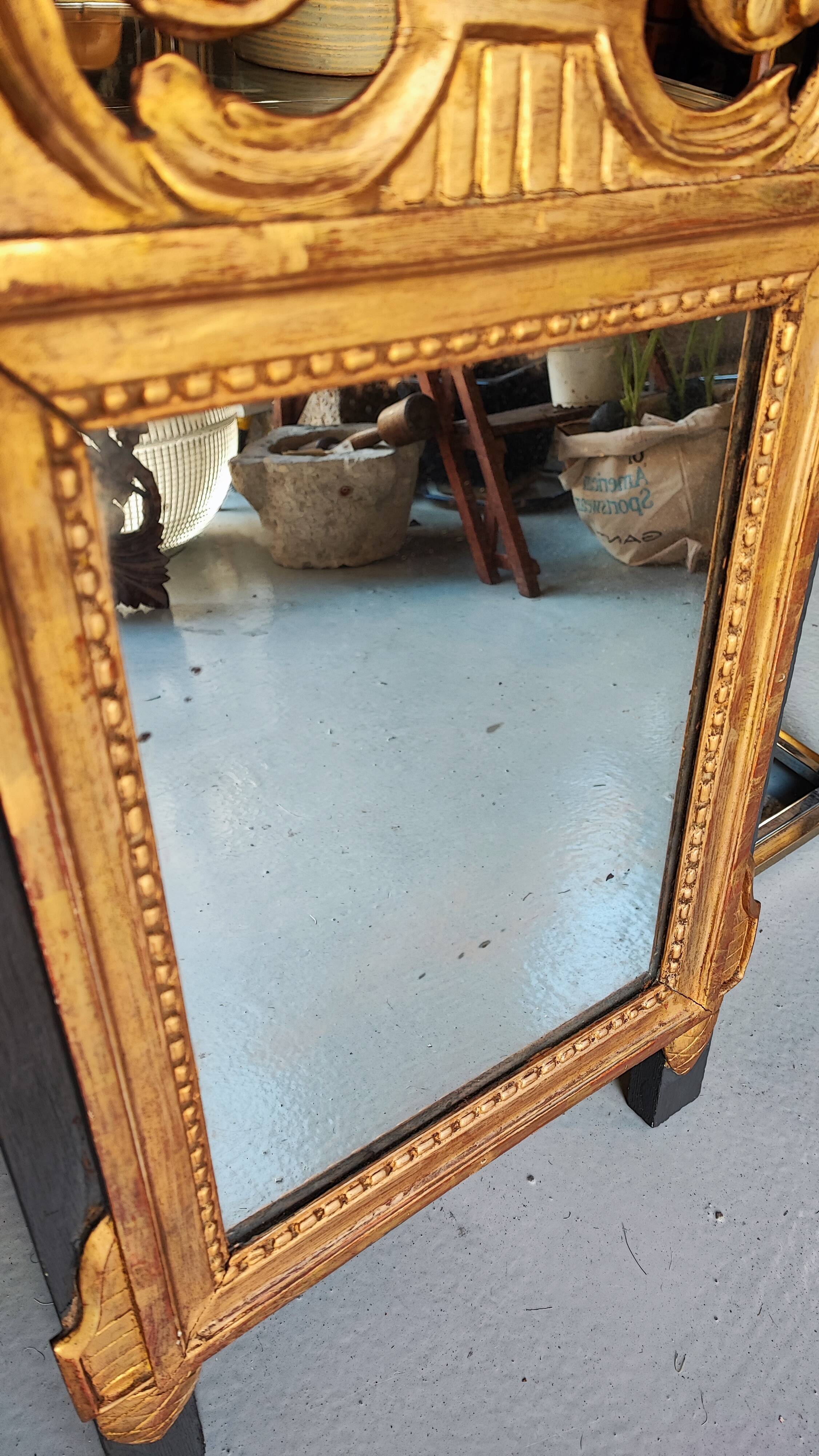 Louis XIV mirror in carved gilded wood, 18th century - 75 cm