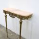 Console in brass and pink alabaster