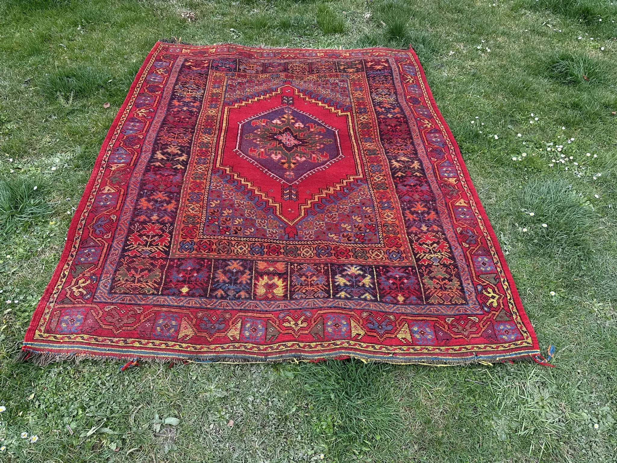 Old Moroccan carpet, made of natural wool and handwoven.