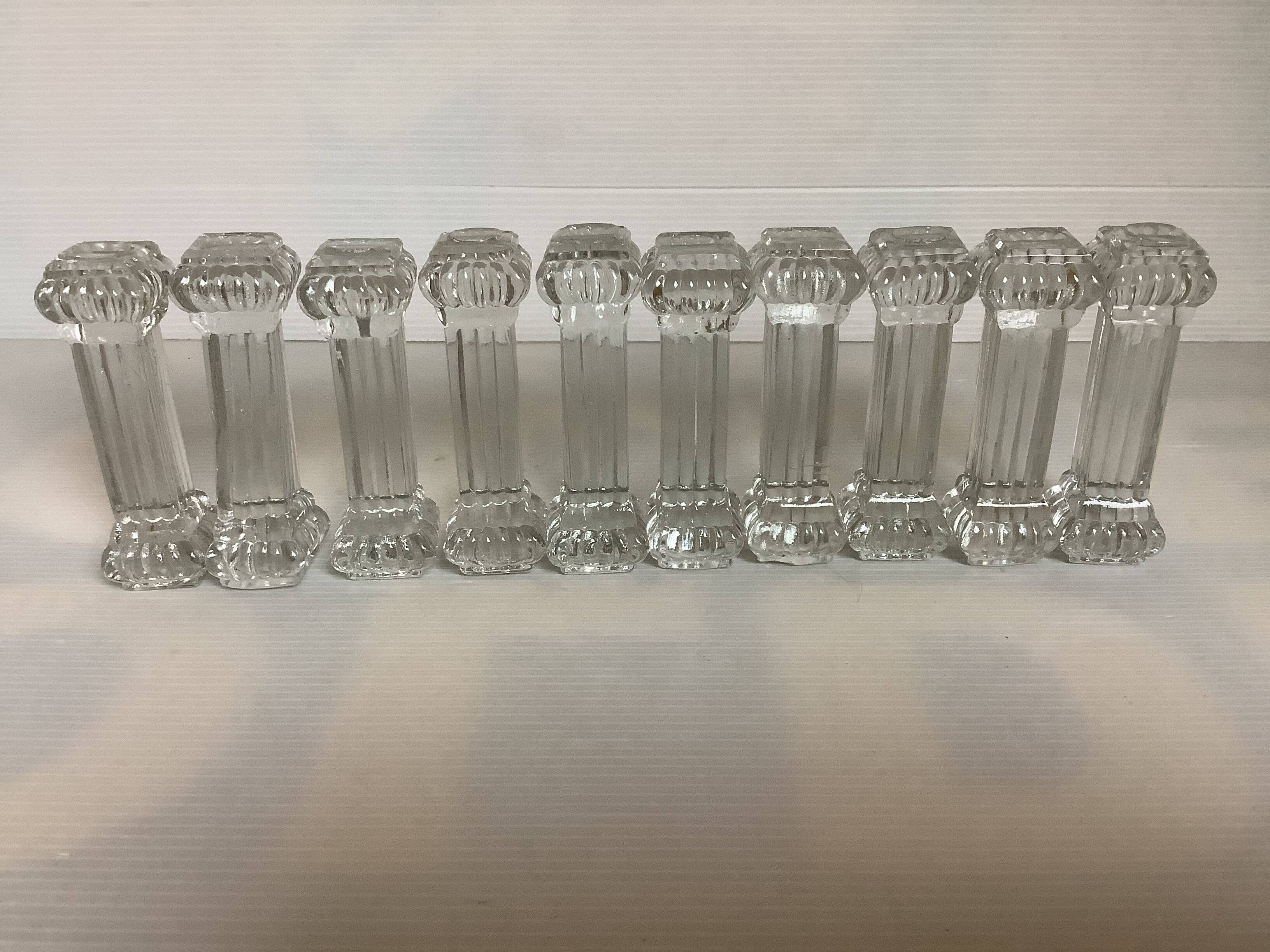 Ten old molded glass knife holders