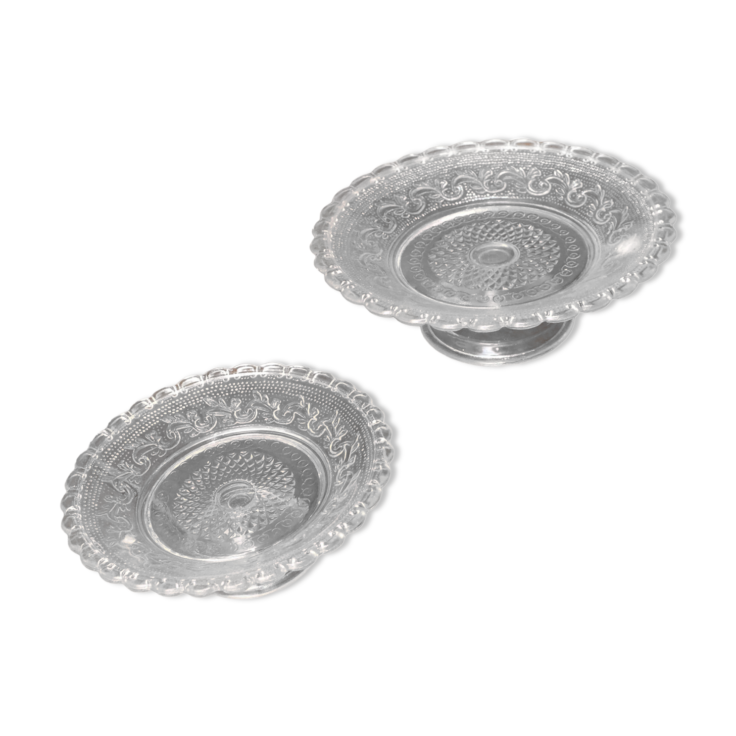 Duo of molded glass display cups, arabesque décor