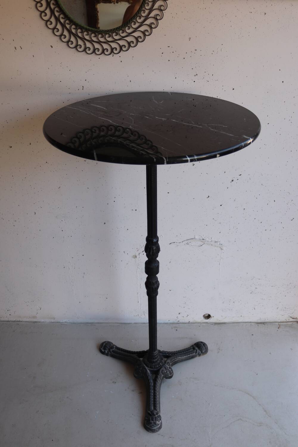 Antique bistro pedestal table in cast iron and veined black marble