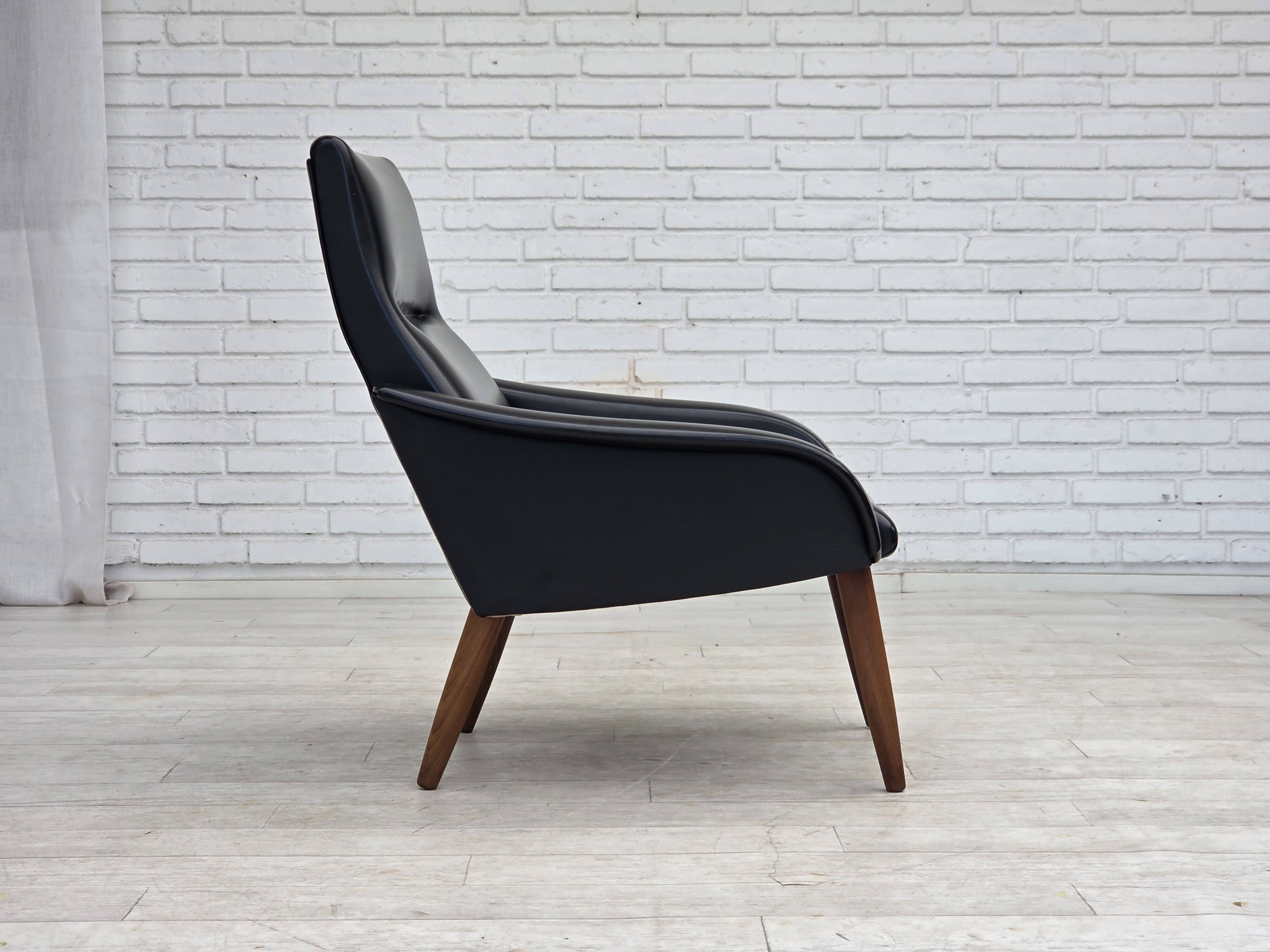 1970s, Danish armchair, black artificial leather, teak wood legs.