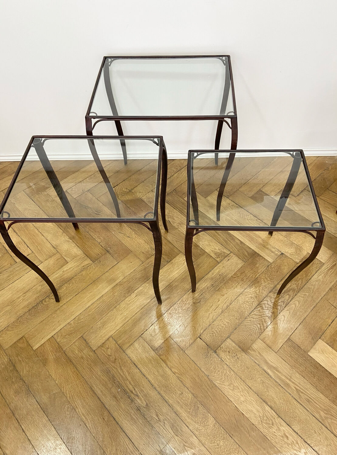 Nesting tables in wrought iron and glass