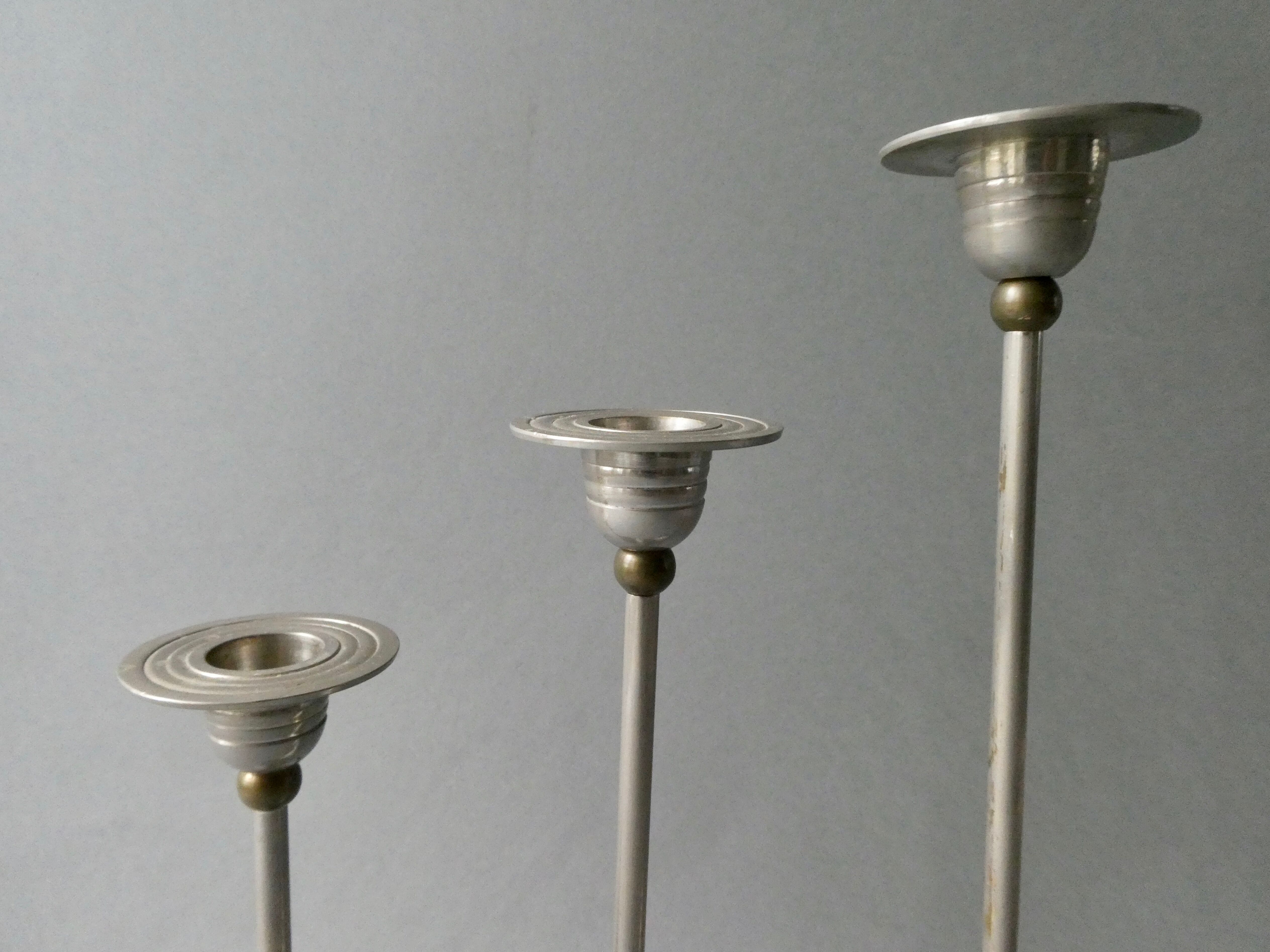 3 bougeoirs en métal argenté et doré