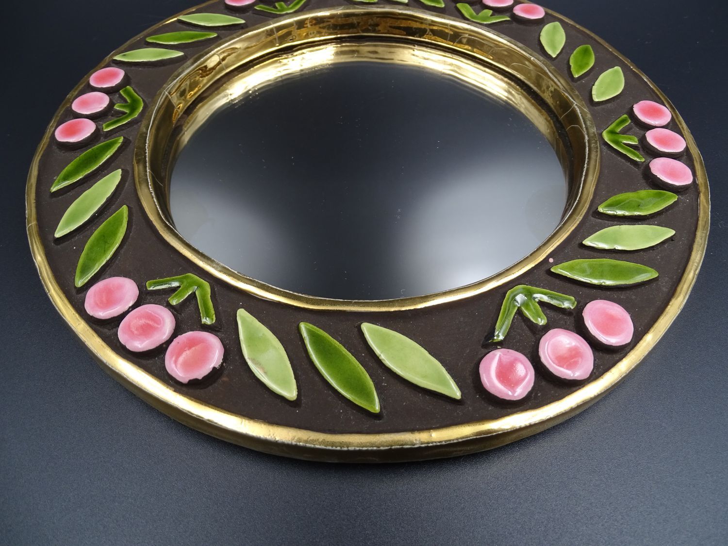 Small round mirror in earthenware- Cherry enamelled decoration - circa 1970
