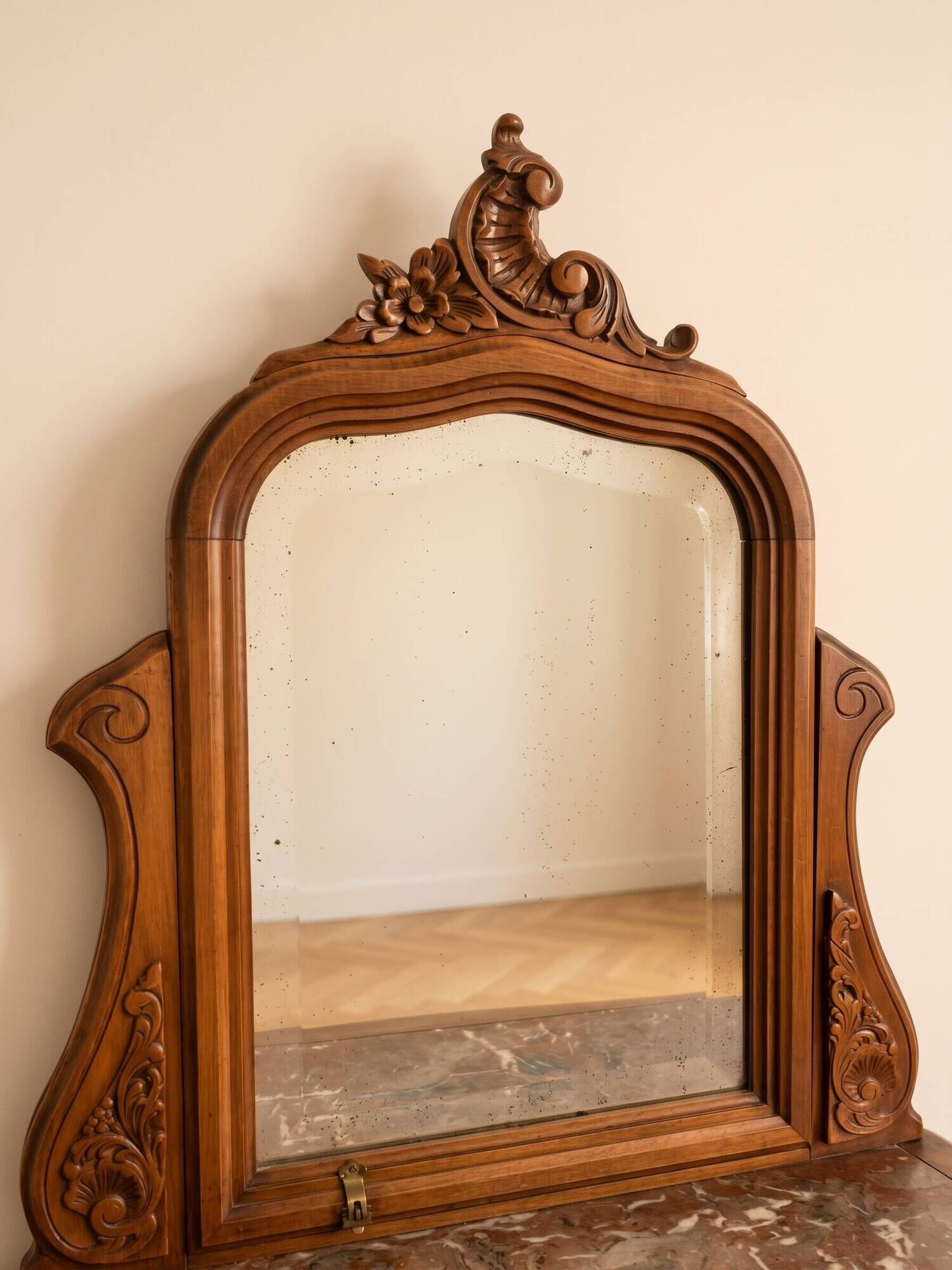 Antique carved wooden dressing table with marble and mirror.