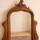 Antique carved wooden dressing table with marble and mirror.