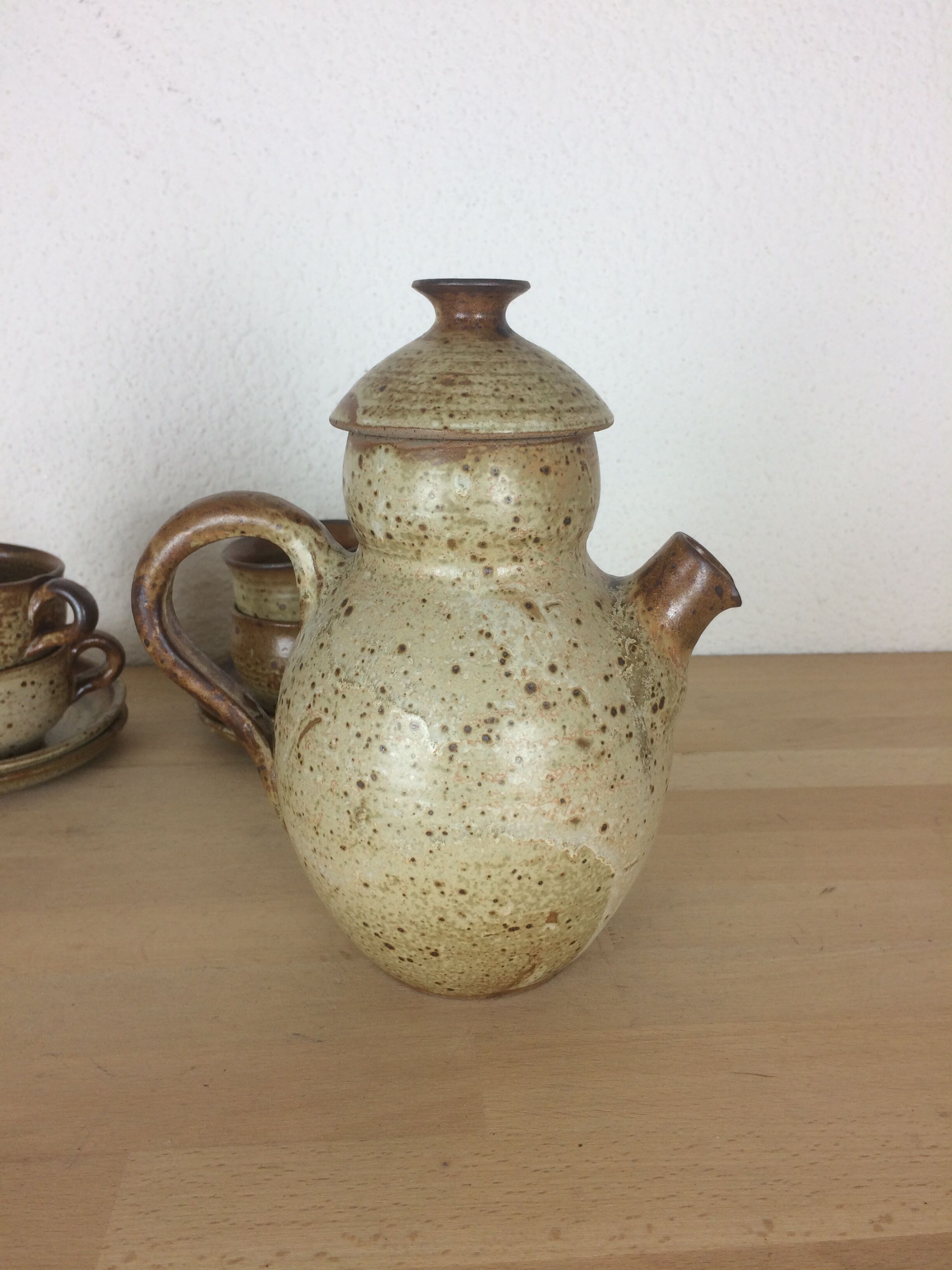 Coffee or tea service in sandstone, cups and teapot