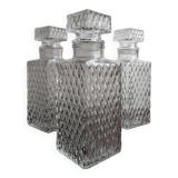 3 diamond-patterned chiseled glass carafes