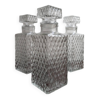 3 diamond-patterned chiseled glass carafes