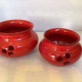 Pair of red Scandinavian candle holders.