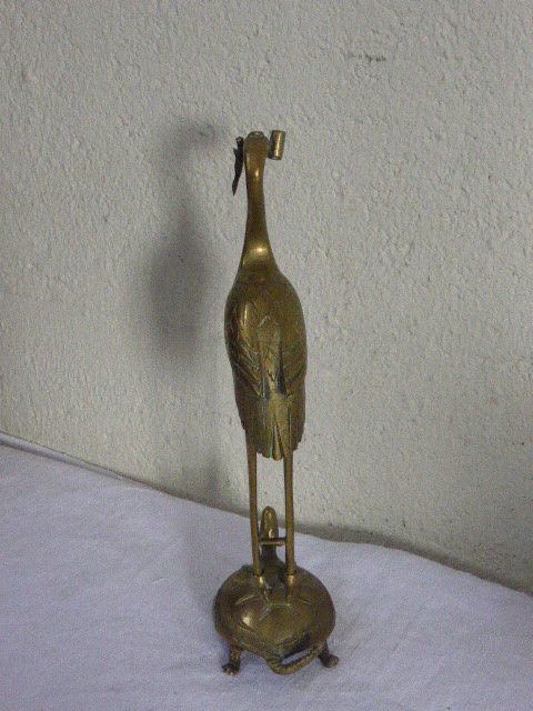 Heron in brass on the back of a turtle, press paper, vintage 1970