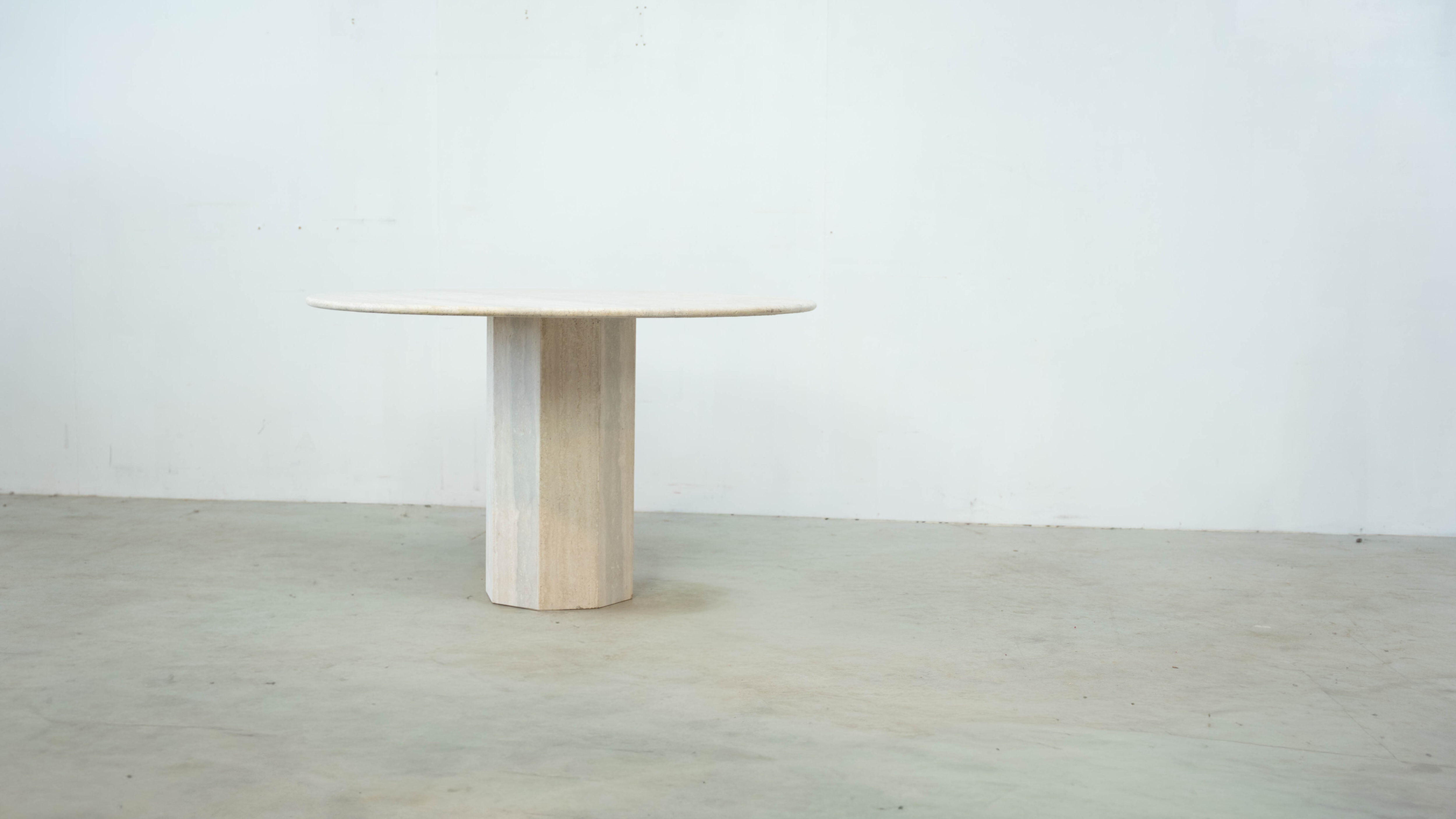 Round Belgian travertine dining table