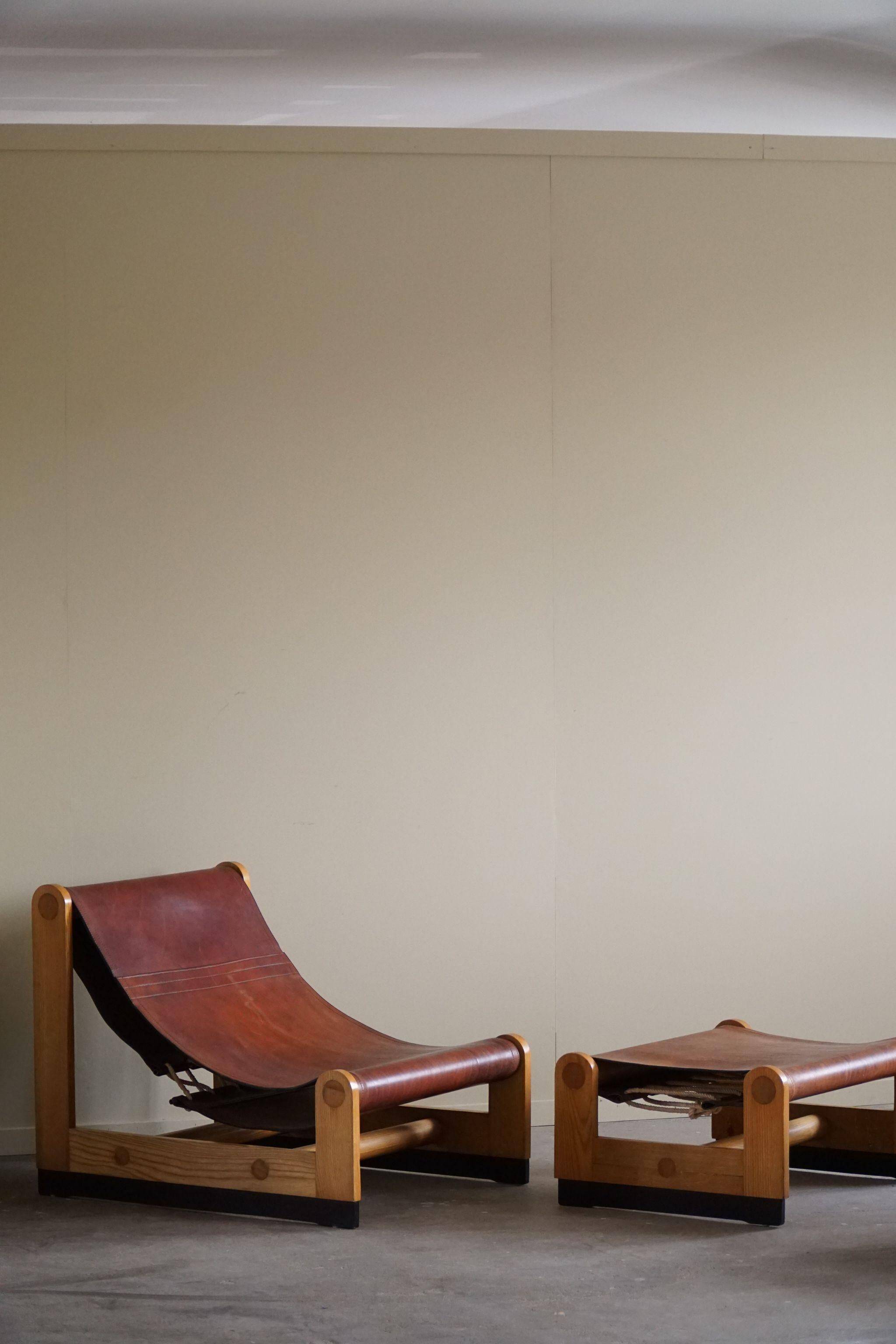 Francesco Lucianetti, Lounge chairs in leather and elm, Italian modern, 1960s