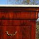 Antique mahogany chest of drawers with white marble.