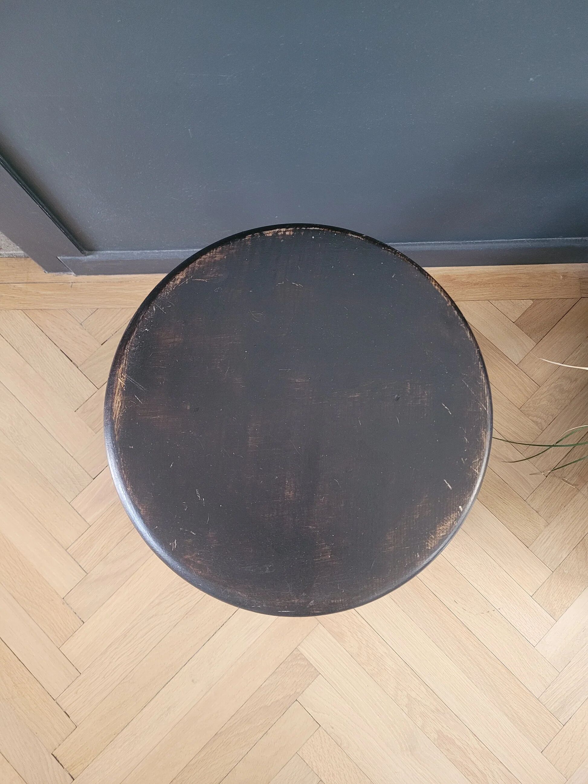 Antique wooden stool with turned legs.