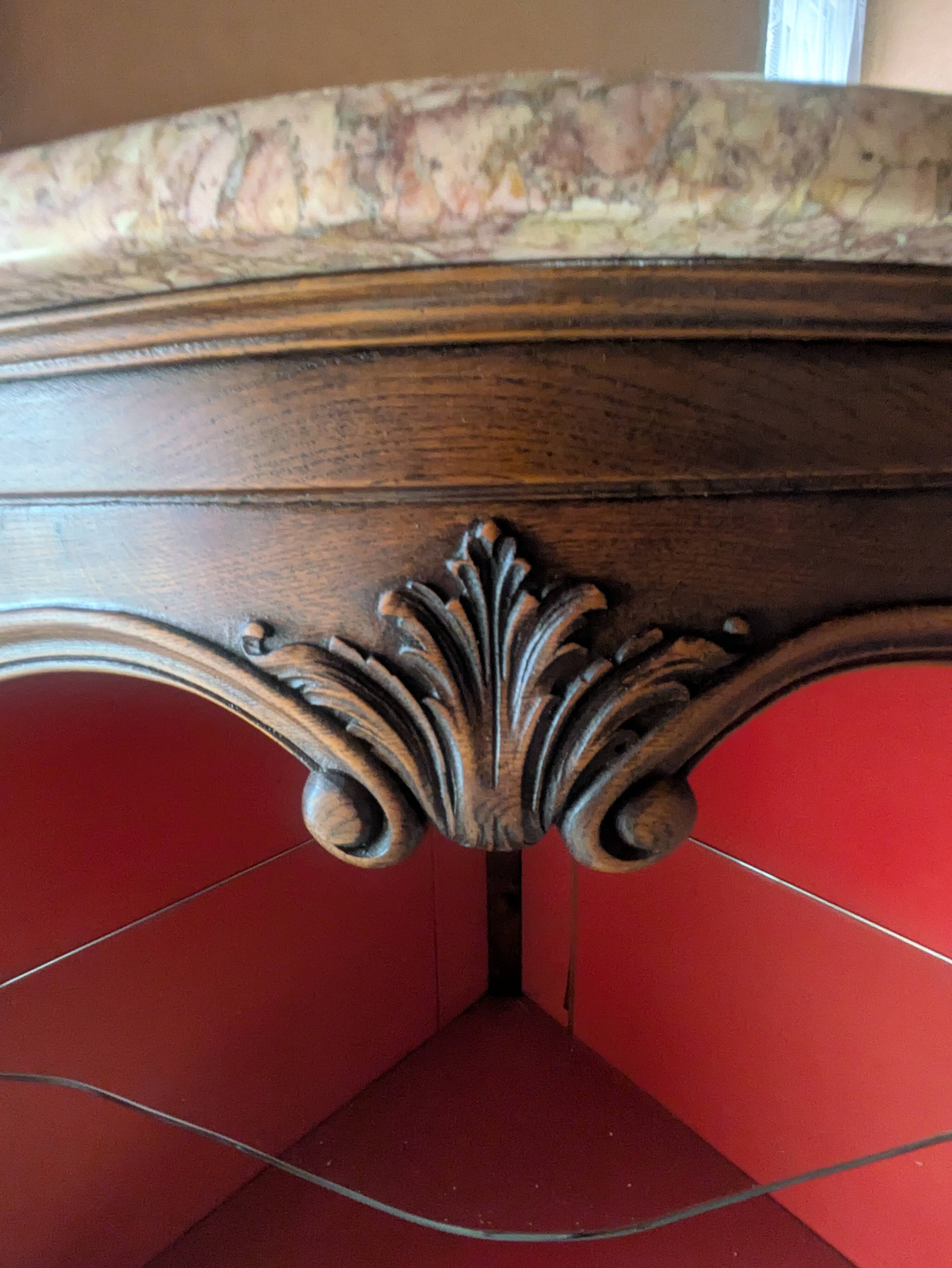 Antique corner cabinet in Louis XV style, topped with a marble surface.