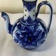 Glazed ceramic carafe with floral decoration