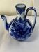 Glazed ceramic carafe with floral decoration