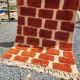 Large Moroccan Berber rug in orange and ecru wool, 400 x 300 cm.