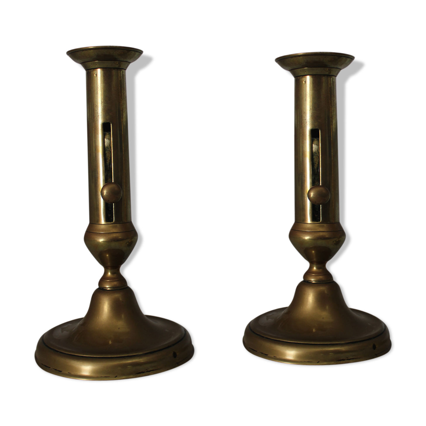 Pair of brass pusher candlesticks