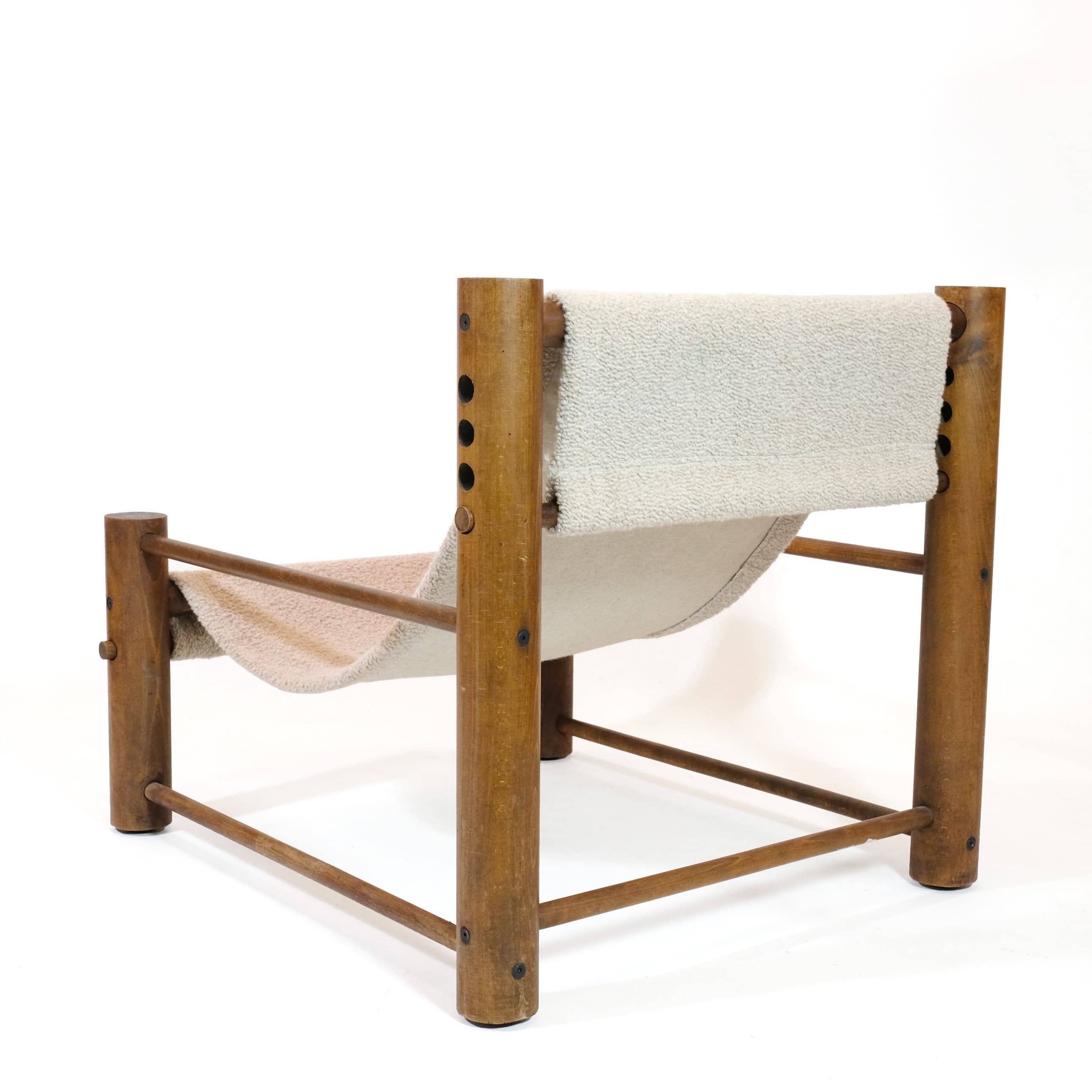 Solid wood armchair with adjustable backrest.