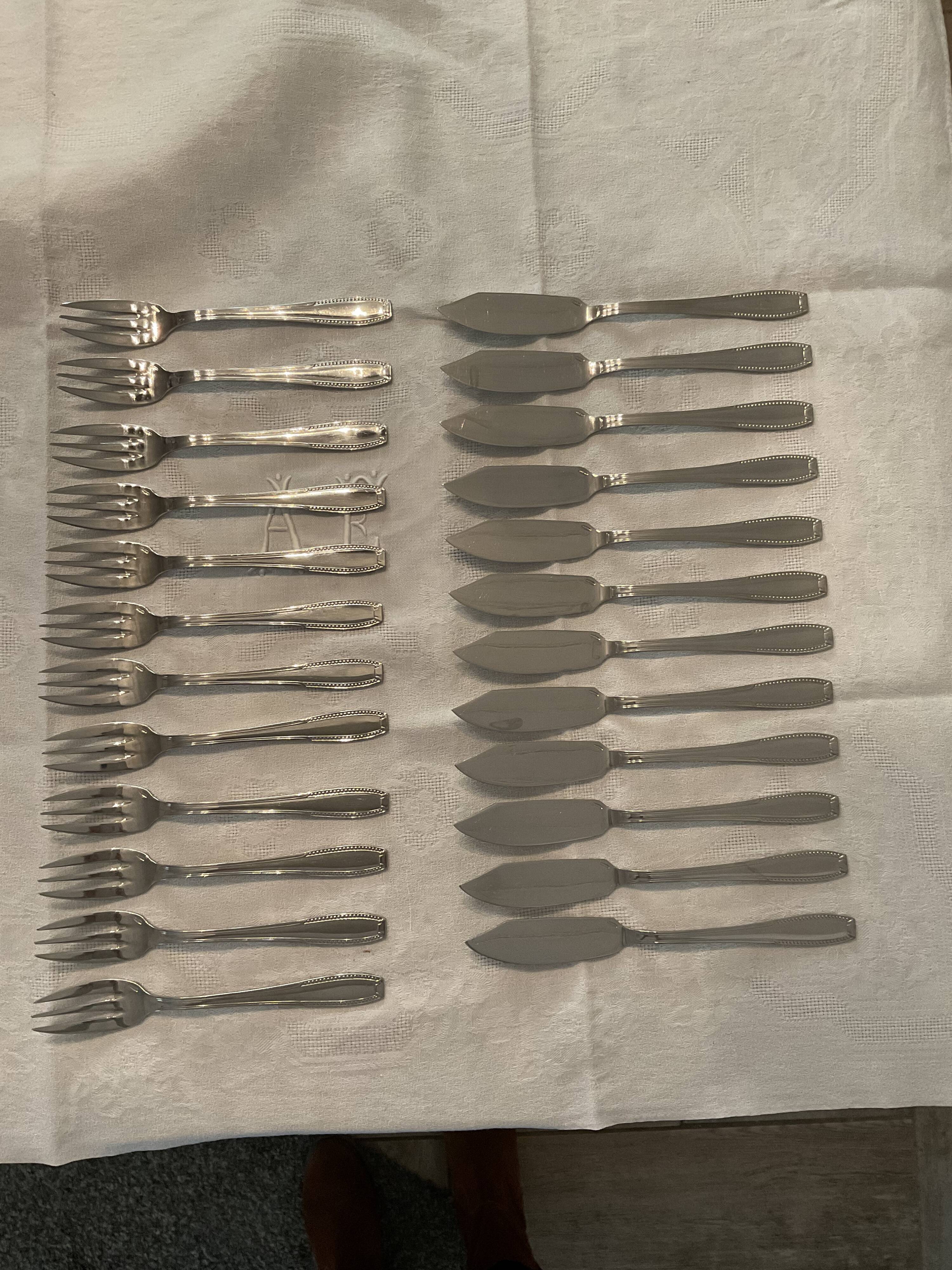 24 fish covers. Forks and knives . Stainless steel. Vintage
