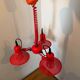Three-lamp suspension in Memphis design style in red metal.