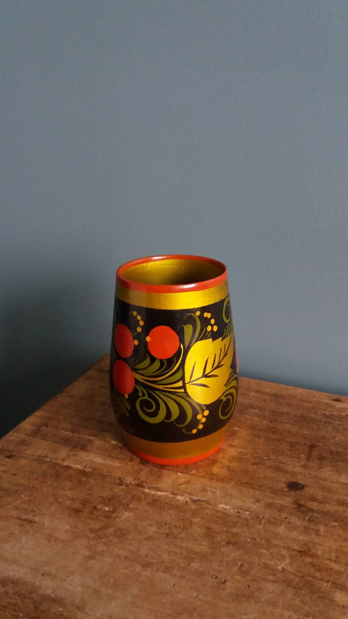 Khokhloma vase, Russian lacquered wood craftsmanship, hand-painted decoration.