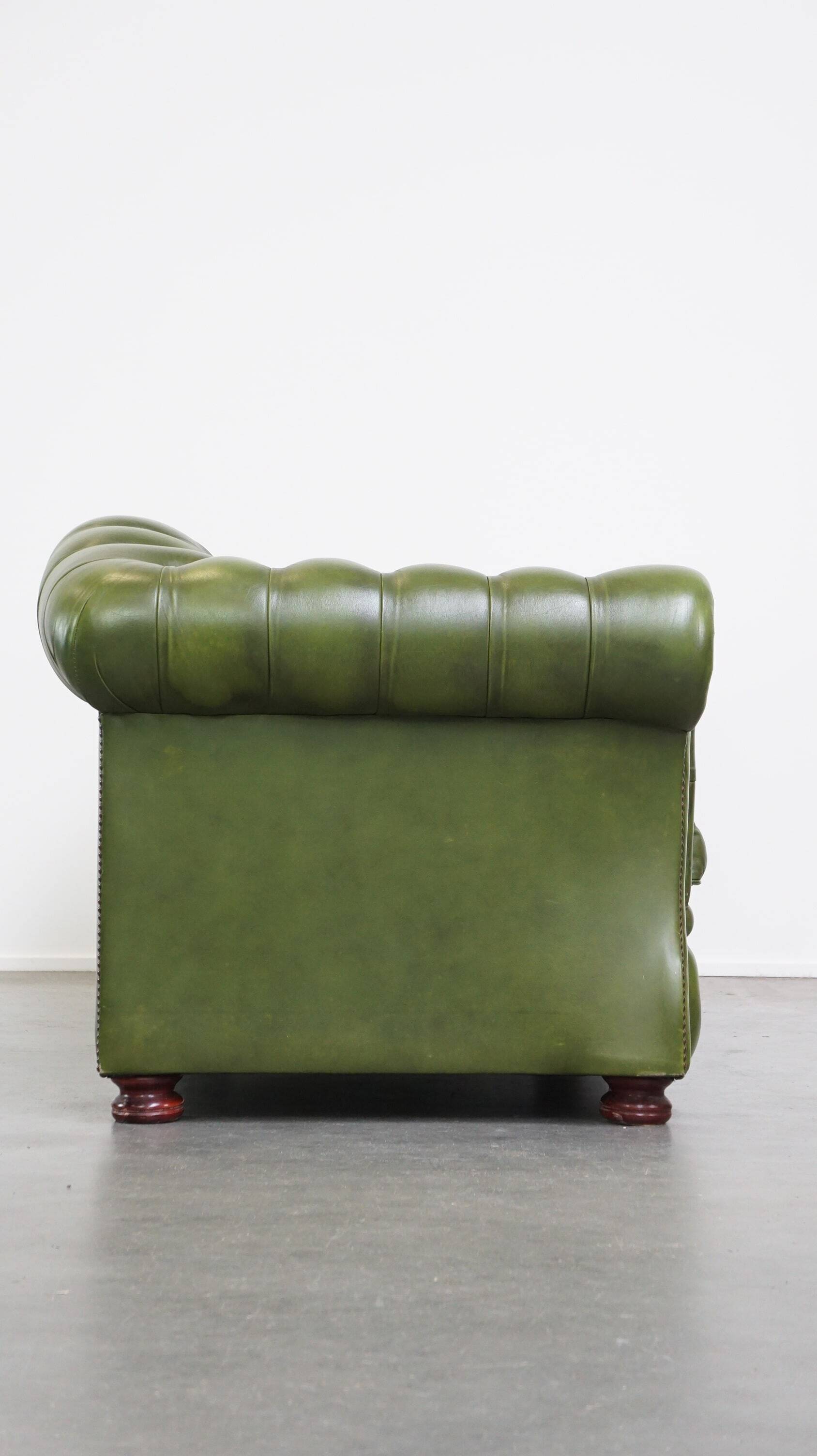 Stylish, English green cow leather spacious 2.5 seater chesterfield sofa