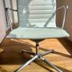 ICF armchair in white leather, four-star base on glides