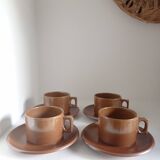 Stoneware coffee cups and saucers