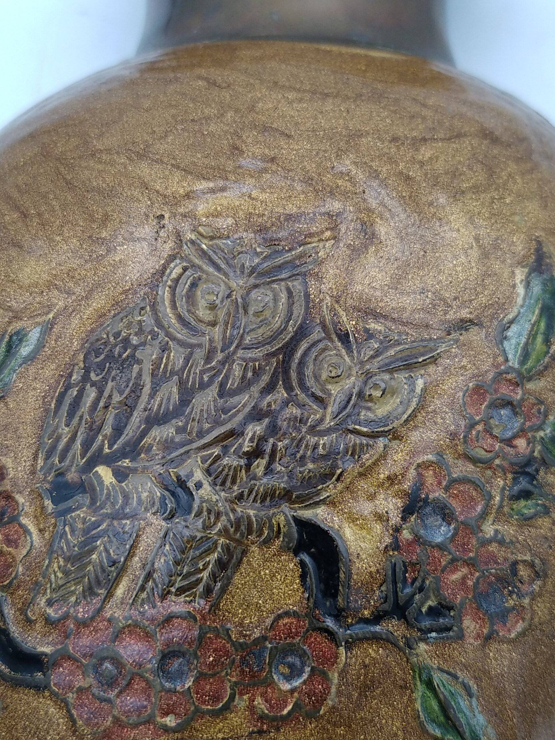 Enamelled brass vase decorated with owls.