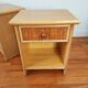 Pair of vintage bedside tables in wood and rattan.