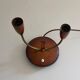 Simple double-headed table lamp in wood and brass, 1960s, Germany.