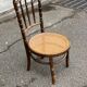 Vintage 19th-century bistro chair made of curved solid wood and caned in the Thonet style.