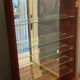 Vitrine en bois doré à suspendre .