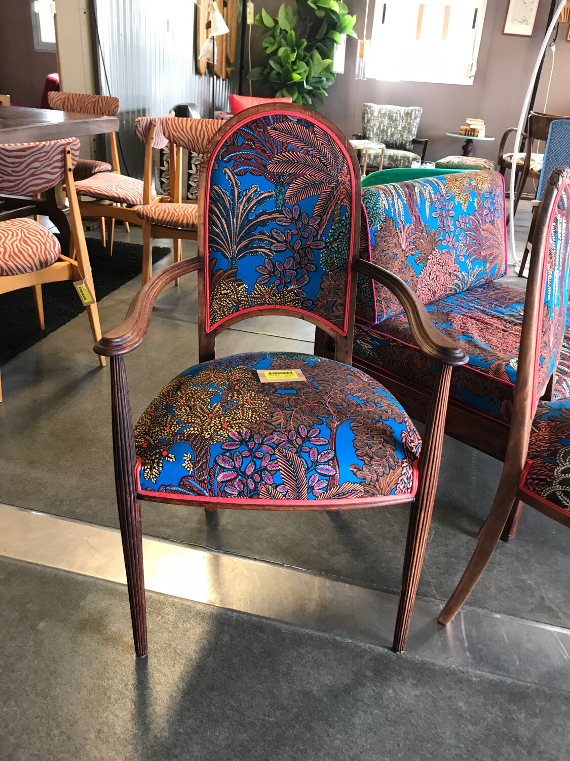 Art Nouveau armchair with a floral seat and backrest.