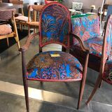 Art Nouveau armchair with a floral seat and backrest.