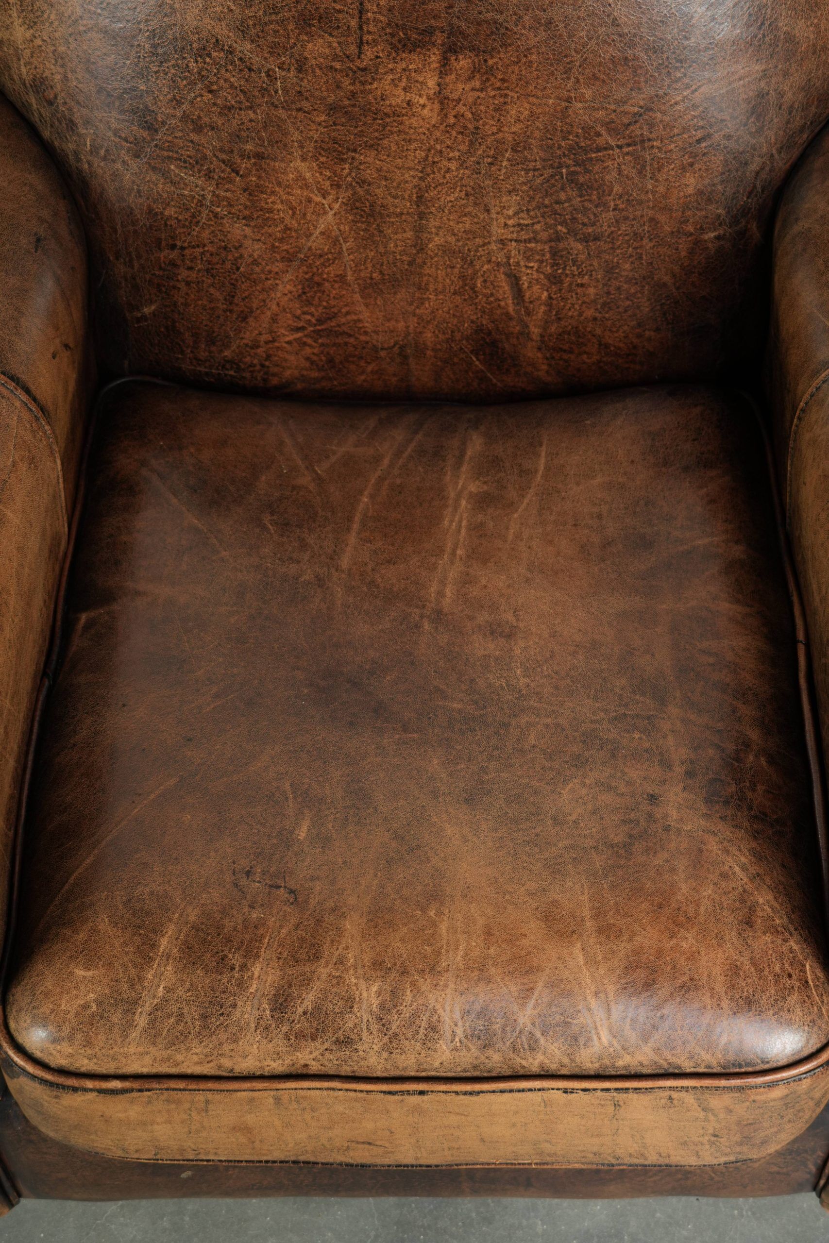 Set of two sheepskin Art Deco design armchairs with beautiful patina