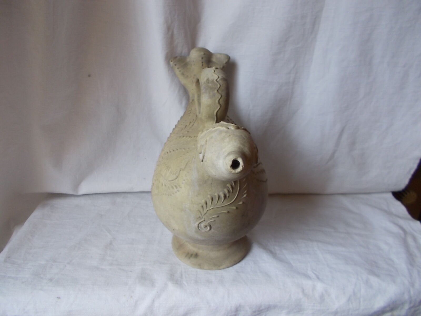 Old grey terracotta jug