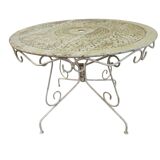 Old garden table in solid wrought iron
