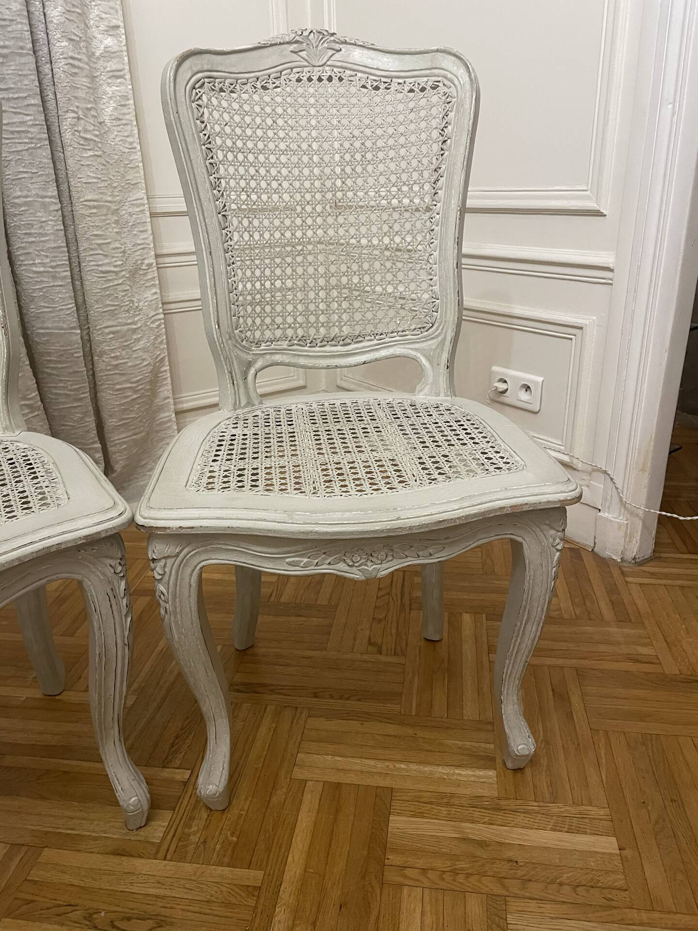 Set of 4 white caned chairs in Louis XV style.