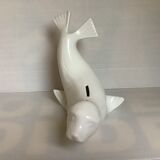 White earthenware sea lion in piggy bank