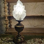 Small globe lamp with flame and brass base for oil.