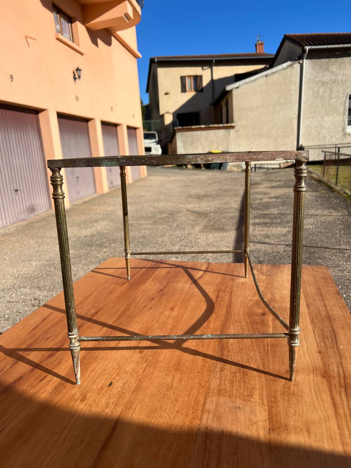Brass side table with smoked glass.